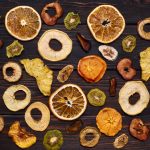 mix-dried-fruits-wooden-table_211889-688