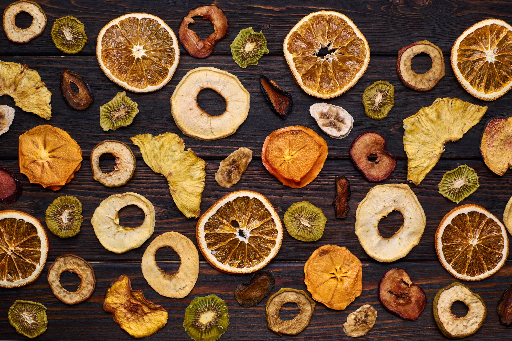 mix-dried-fruits-wooden-table_211889-688